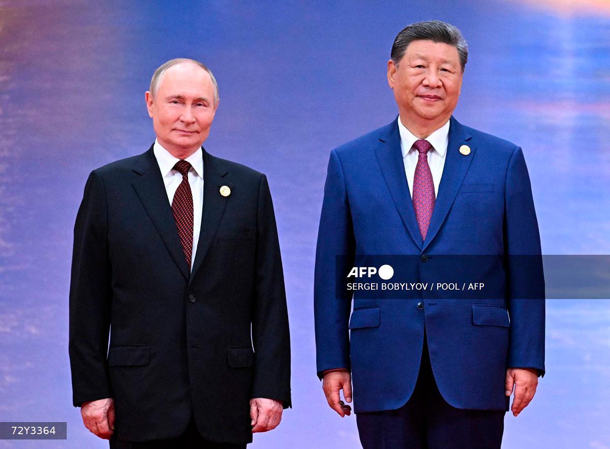 Russia’s President Vladimir Putin and Chinese President Xi Jinping pose during a welcoming ceremony of the Shanghai Cooperation Organization (SCO) Summit in Tianjin on August 31, 2025. - Sergei BOBYLYOV / POOL / AFP