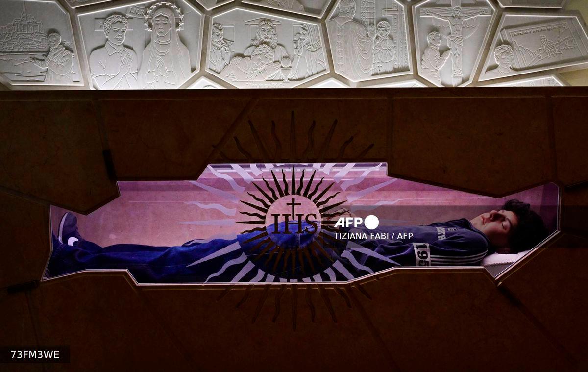 A picture shows the tomb of Blessed Carlo Acutis, an adolescent who spent his life spreading his faith online, earning the moniker God's Influencer, in the Shrine of the Renunciation in Assisi, part of the Church of Saint Mary Major, on April 3, 2025. - AFP