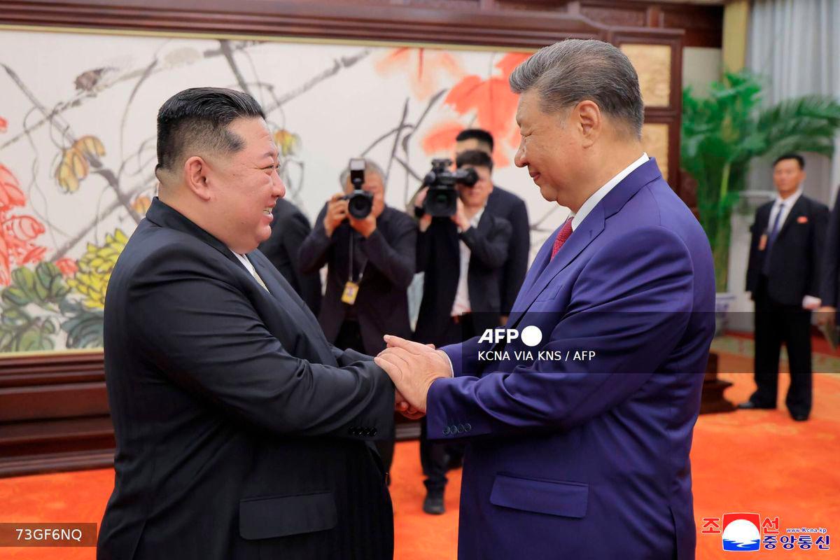 This picture taken on September 4, 2025 and released from North Korea's official Korean Central News Agency (KCNA) on September 5, 2025 shows North Korean leader Kim Jong Un (L) shaking hands with Chinese President Xi Jinping in Beijing. - Photo by KCNA VIA KNS / AFP