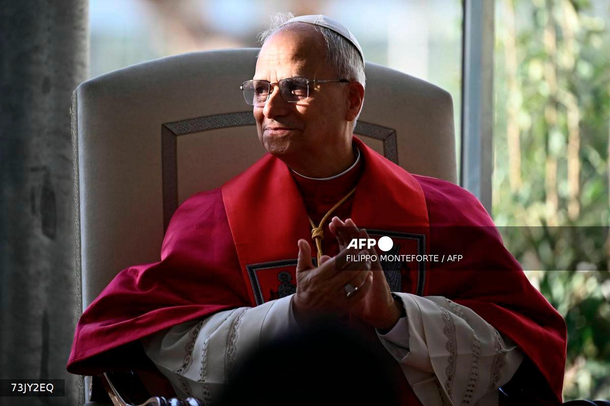 Pope Leo XIV applauds singer Andrea Bocelli and his son Matteo at the end of a Liturgy of the Word following the inauguration of the Borgo Laudato Si' Advanced Training Center at the papal summer residence in Castel Gandolfo, on September 5, 2025. - AFP