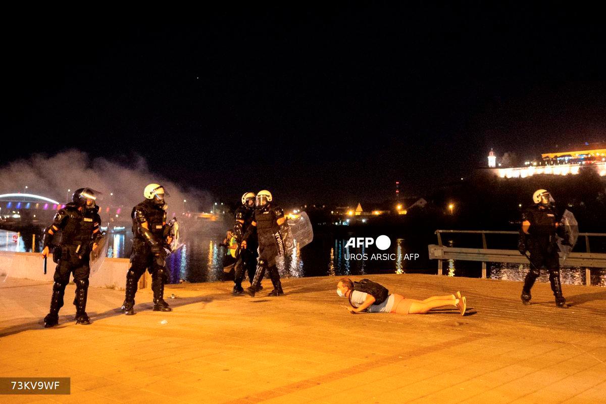 An anti-government protester is detained after clashes with police in the Serbian city of Novi Sad on September 5, 2025, after several thousand rallied seeking early elections. - AFP