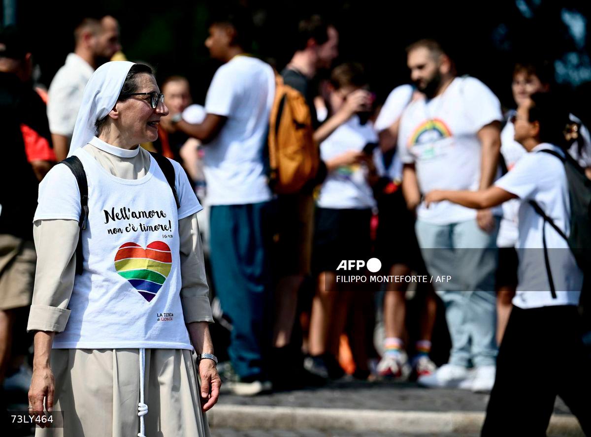 A nun wears a t-shirt reading In love there is no fear as she gathers to march with other pilgrims to pass the holy door of St Peter's basilica during the LGTB jubilee, at the Vatican, on September 6, 2025. - AFP