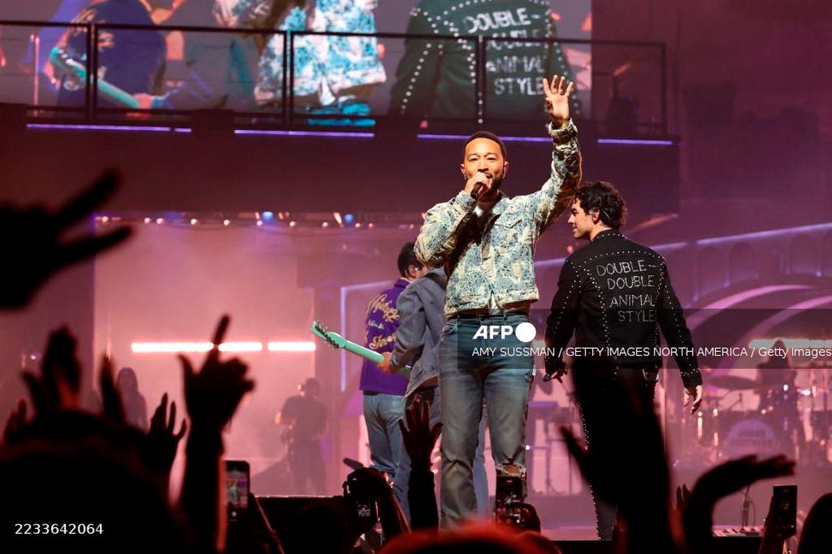 John Legend speaks on stage during Jonas Brothers: JONAS20 Greetings From Your Hometown Tour at Intuit Dome on September 6, 2025 in Inglewood, California. - Getty Images via AFP