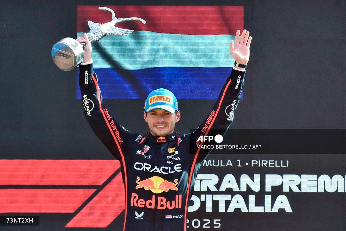 Red Bull Racing's Dutch driver Max Verstappen celebrates his victory on the podium after winning the Italian Formula One Grand Prix at the Autodromo Nazionale Monza circuit, in Monza, northern Italy, on September 7, 2025. - AFP