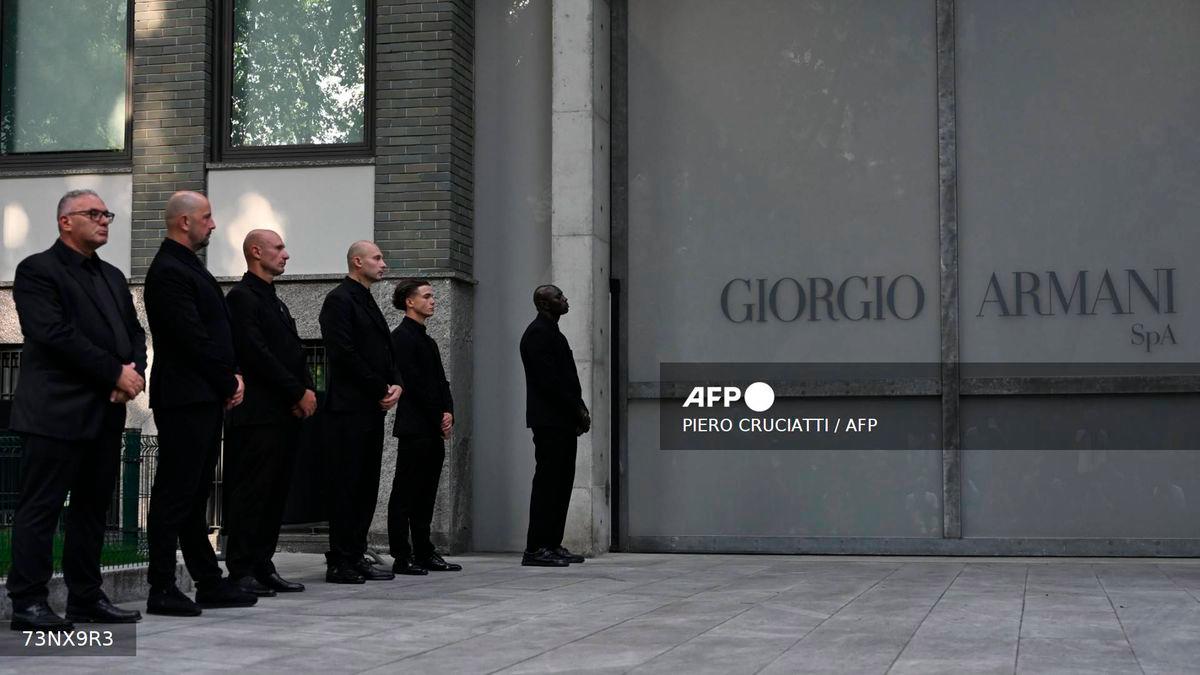 Armani's security staff members lined up outside the Armani Theatre where late Italian fashion designer Giorgio Armani lies-in state, in Milan on September 7, 2025. - AFP