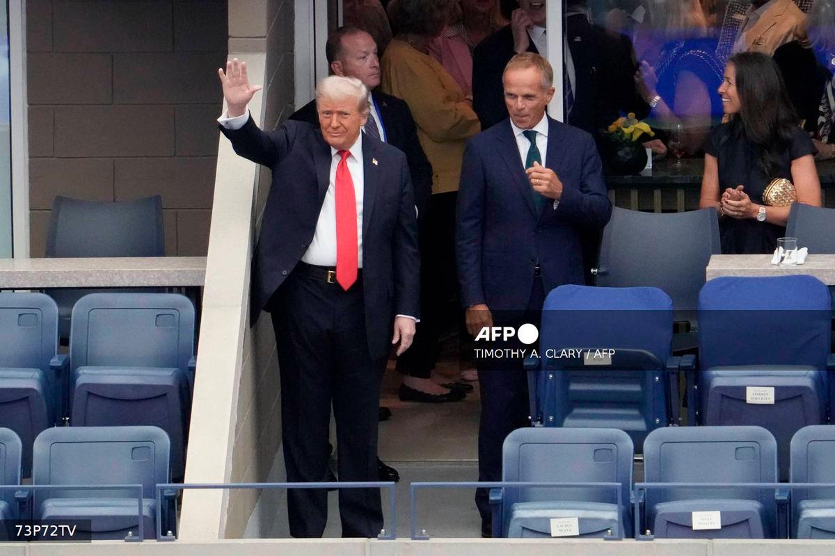 US President Donald Trump (L) waves as he arrives to attend the men's singles final tennis match between Spain’s Carlos Alcaraz and Italy’s Jannik Sinner on the last day of the US Open tennis tournament at the USTA Billie Jean King National Tennis Center in New York City, on September 7, 2025. - AFP