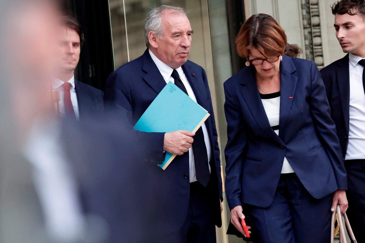 France’s Prime Minister Francois Bayrou leaves the National Assembly after the result of a confidence vote over the government’s austerity budget, at the National Assembly in Paris on September 8, 2025. - AFP