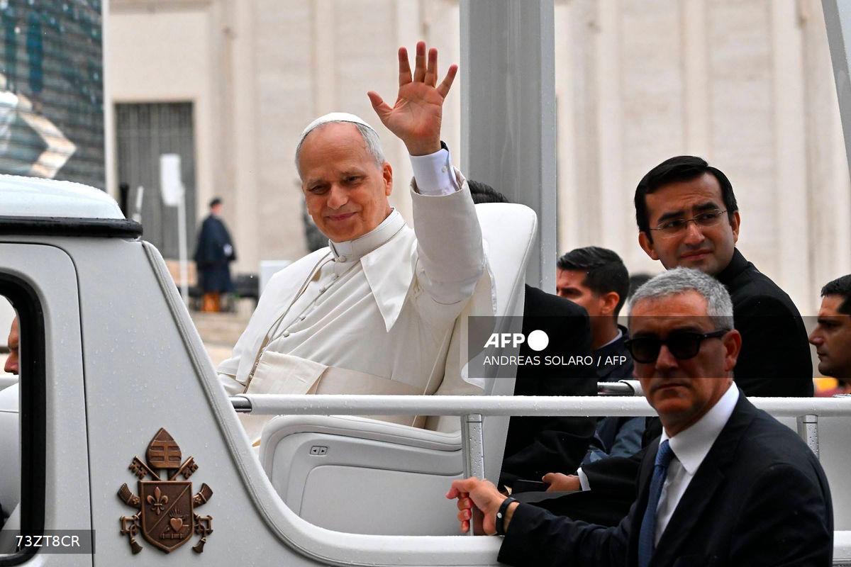 Pope Leo XIV waves as he leaves the weekly general audience at St. Peter’s square in the Vatican on September 10, 2025. (Photo by Andreas SOLARO / AFP)