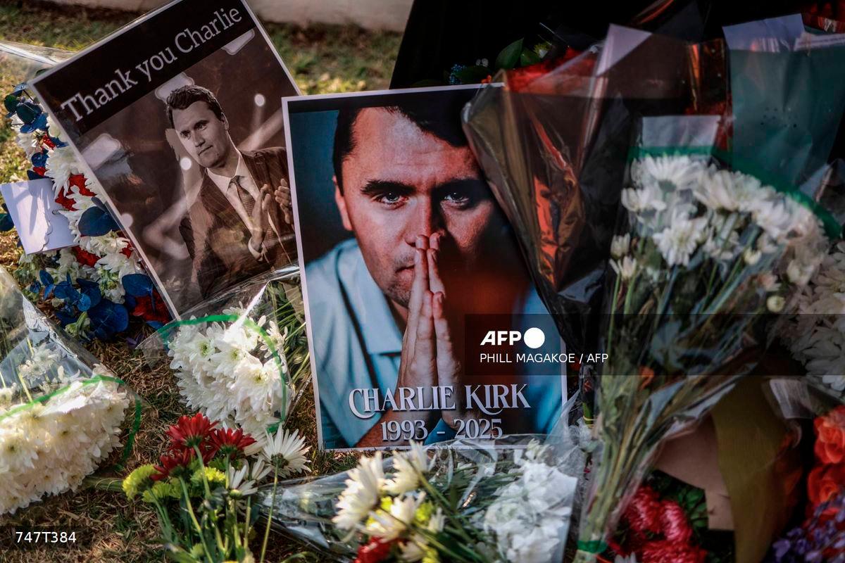 A general view of a wreath laid by mourners outside the US Embassy in Pretoria on September 11, 2025 following the fatal shooting of US youth activist and influencer Charlie Kirk while speaking during an event at Utah Valley University in Orem, Utah, United States. - AFP