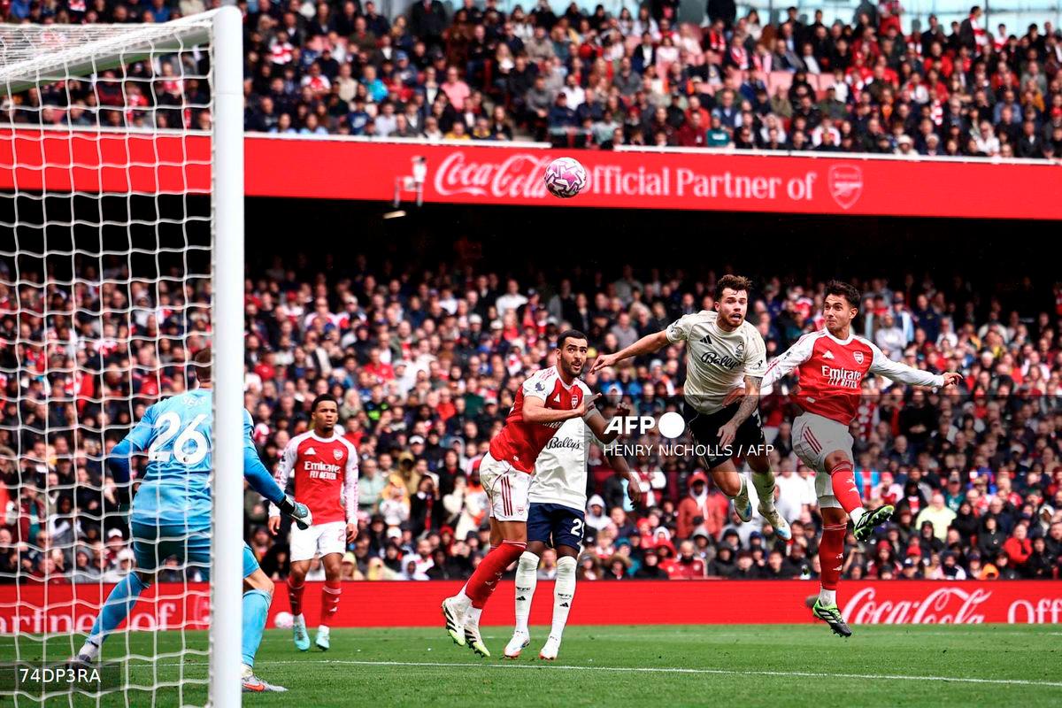 Arsenal's Spanish defender #36 Martin Zubimendi (R) scores the team's third goal during the English Premier League football match between Arsenal and Nottingham Forest at the Emirates Stadium in London on September 13, 2025. - AFP
