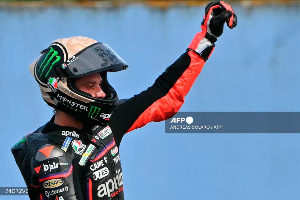 Aprilia Racing team's Italian MotoGP rider Marco Bezzecchi celebrates winning the San Marino Moto GP Sprint Race at the Misano World Circuit Marco Simoncelli, in Misano Adriatico, northern Italy, on September 13, 2025. - AFP