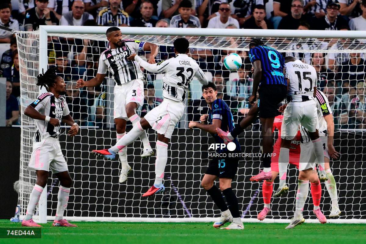 Inter Milan's French forward #09 Marcus Thuram (C) heads the ball and scores his team third goal during the Italian Serie A football match between Juventus and Inter Milan at the Allianz stadium in Turin, northern Italy, on September 13, 2025. - AFP
