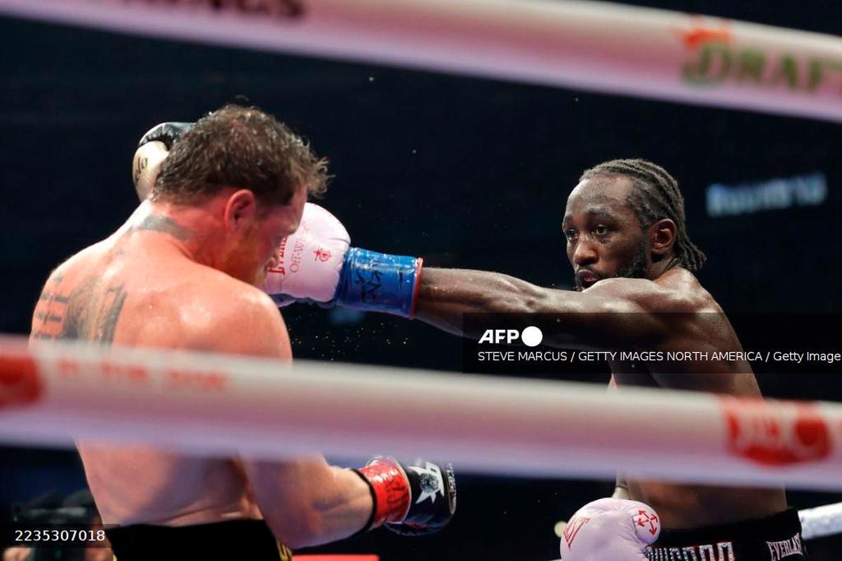 Terence Crawford (R) lands a left on Canelo Alvarez in their undisputed super middleweight title fight during Netflix's Canelo v Crawford Fight Night at Allegiant Stadium on September 13, 2025 in Las Vegas, Nevada. - Getty Images via AFP