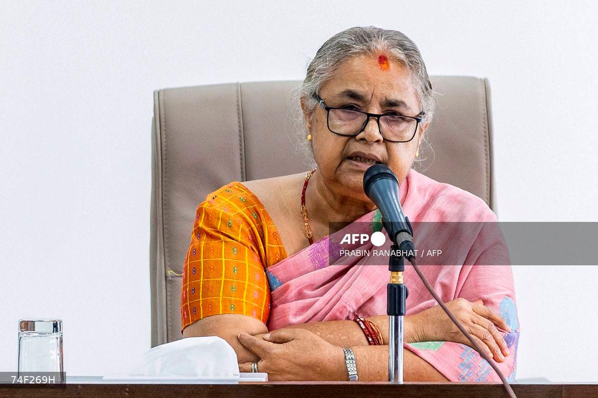 Newly-elected Prime Minister of Nepal’s interim government Sushila Karki speaks with officials at the prime minister’s office in Kathmandu on September 14, 2025. (Photo by PRABIN RANABHAT / AFP)