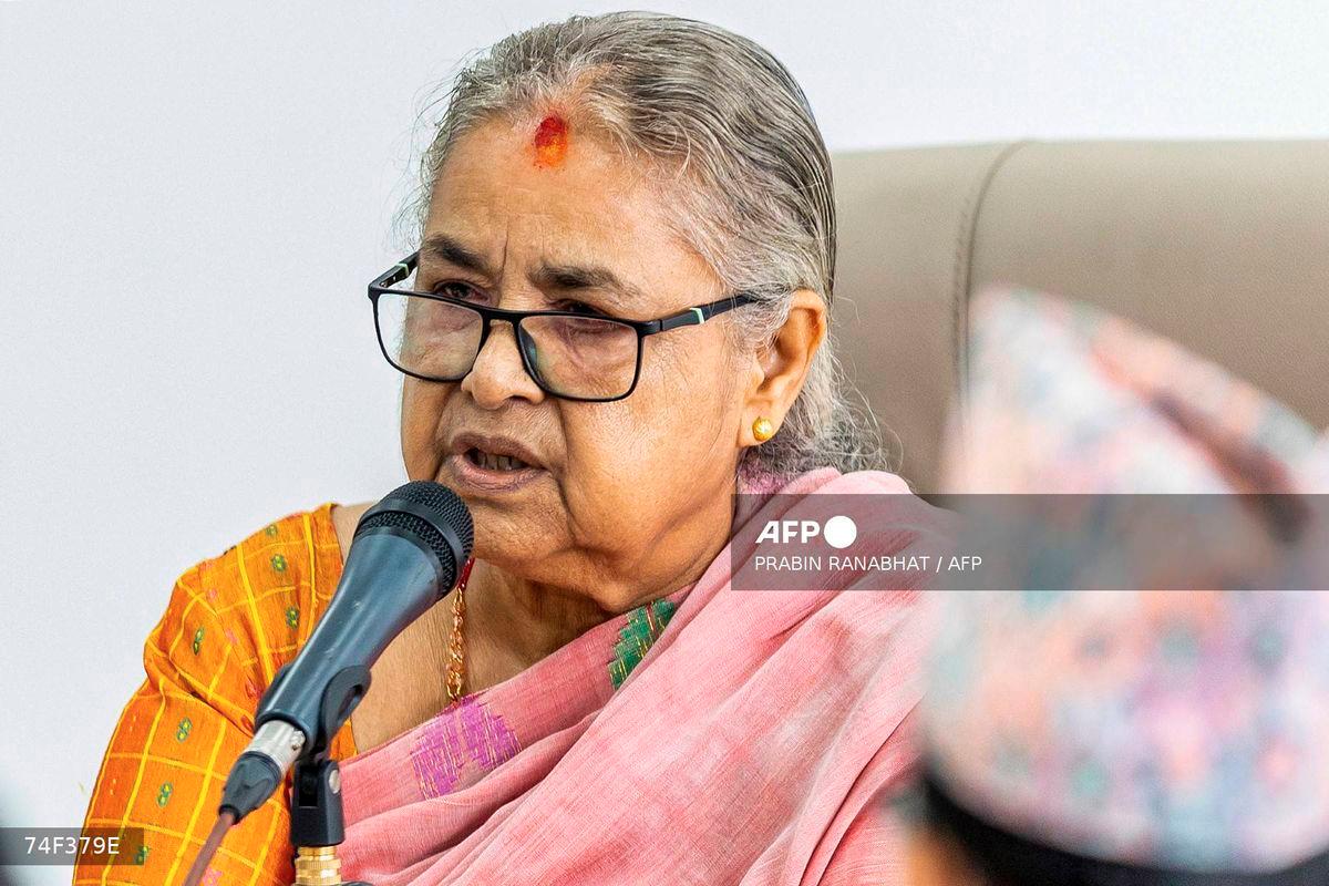 Newly-elected Prime Minister of Nepal's interim government Sushila Karki speaks with officials at the prime minister's office in Kathmandu on September 14, 2025. - AFP