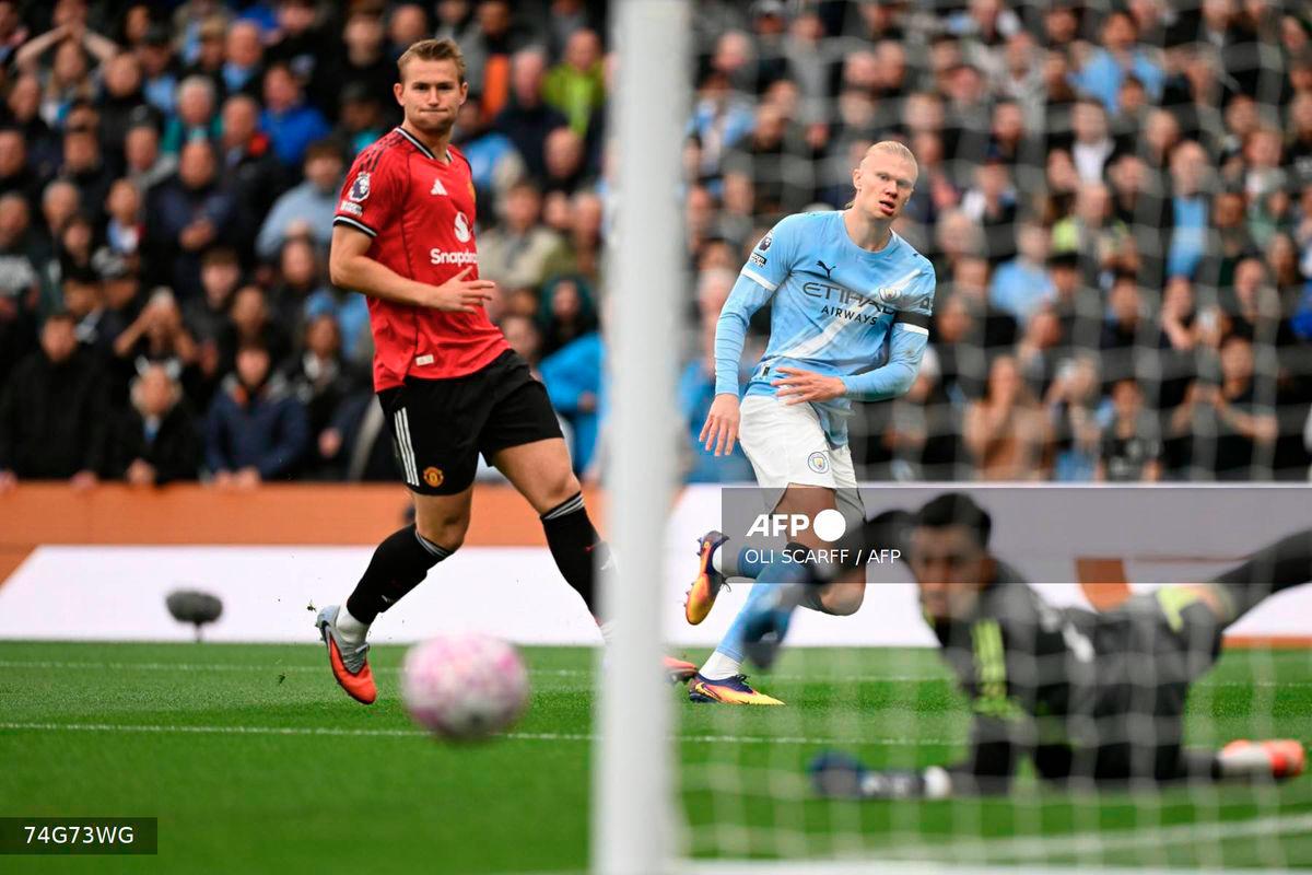 Manchester City's Norwegian striker #09 Erling Haaland (C) shoots but misses the target in the first moments of the English Premier League football match between Manchester City and Manchester United at the Etihad Stadium in Manchester, north west England, on September 14, 2025. - AFP