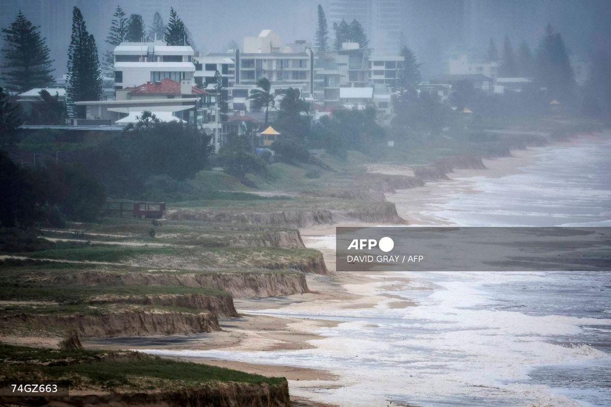 (FILES) A file photo taken on March 9, 2025 shows a general view of erosion at Miami Beach after the sand was washed away during Tropical Cyclone Alfred on the Gold Coast. Rising oceans caused by climate change will threaten 1.5 million Australians by 2050, a landmark report warned on September 15, 2025 ahead of Australia releasing its emission targets this week. (Photo by David GRAY / AFP)