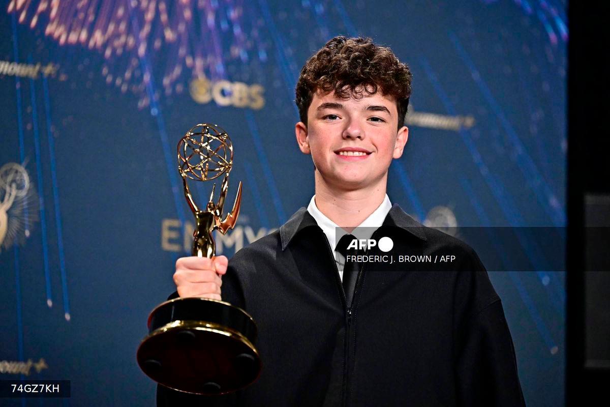 British actor Owen Cooper poses in the press room with the award for Outstanding Supporting Actor in a Limited or Anthology Series or Movie for “Adolescence” during the 77th Primetime Emmy Awards at the Peacock Theatre at LA Live in Los Angeles on September 14, 2025. (Photo by Frederic J. Brown / AFP)