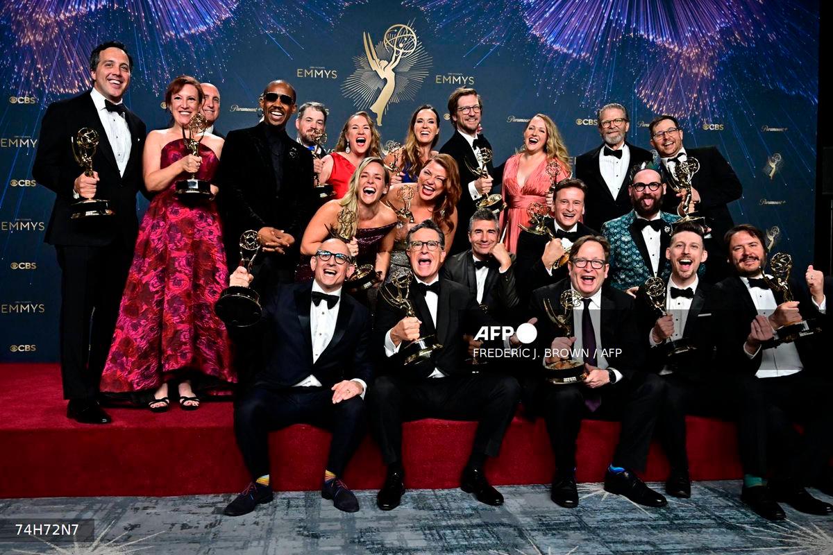 US comedian writer Stephen Colbert (C) poses in the press room with the award for Outstanding Talk Series award for “The Late Show with Stephen Colbert” during the 77th Primetime Emmy Awards at the Peacock Theatre at LA Live in Los Angeles on September 14, 2025. (Photo by Frederic J. Brown / AFP)