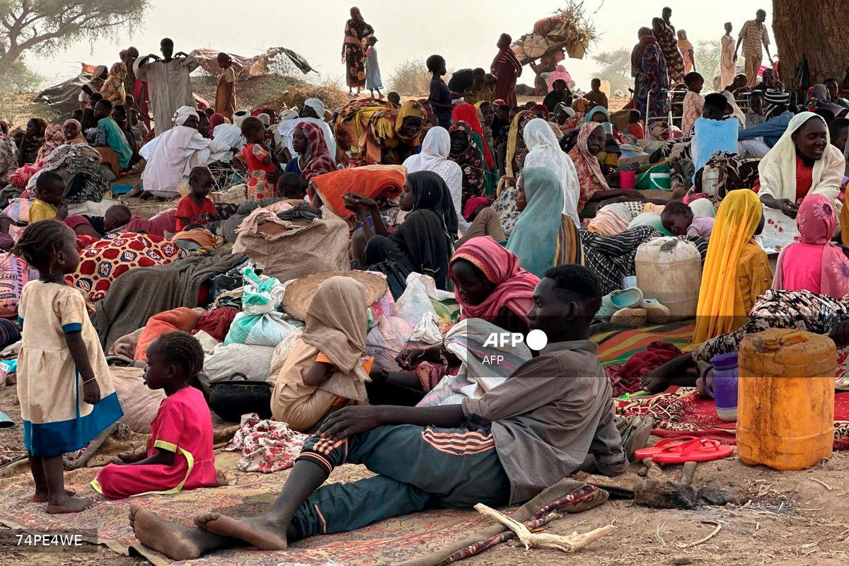 (FILES) People who fled the Zamzam camp for the internally displaced after it fell under RSF control, rest in a makeshift encampment in an open field near the town of Tawila in war-torn Sudan's western Darfur region on April 13, 2025. - AFP