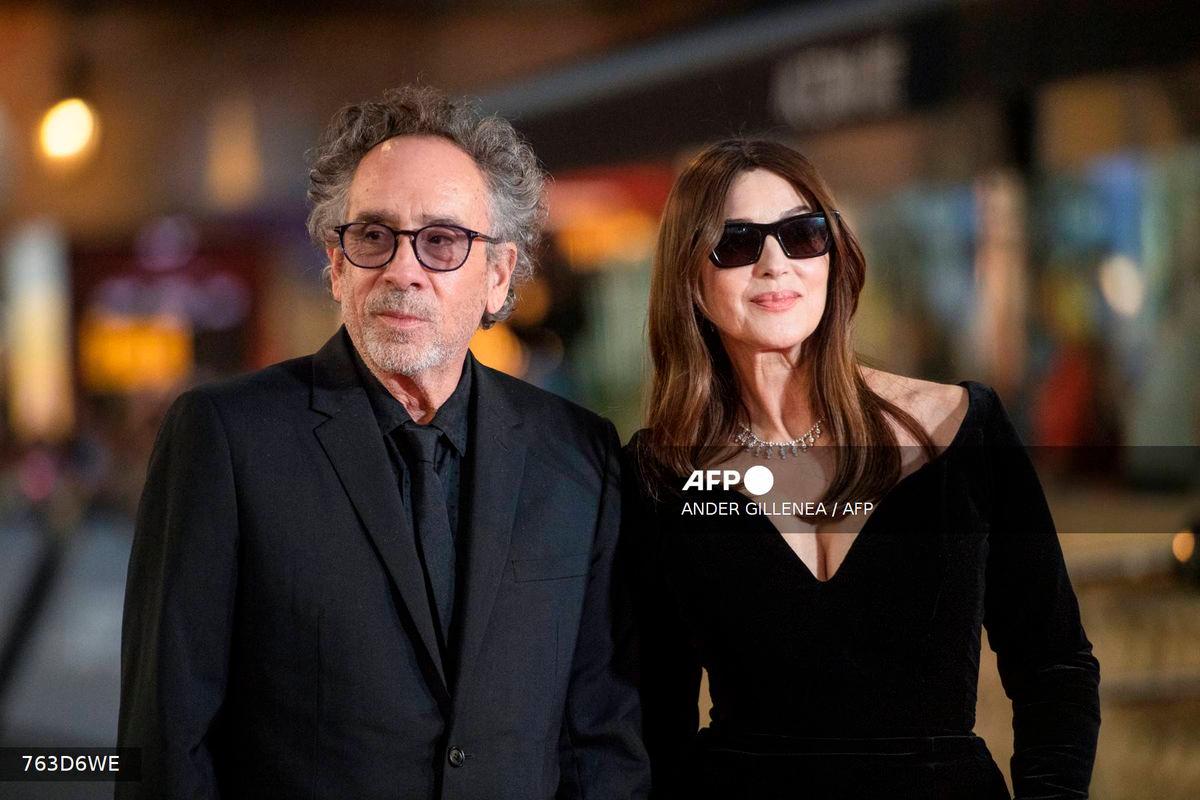 (FILES) US director Tim Burton (L) and Italian actress Monica Bellucci pose on the red carpet to promote the film “Maria Callas: Letters and Memoirs” during the 72nd San Sebastian International Film Festival in the northern Spanish Basque city of San Sebastian on September 26, 2024. (Photo by ANDER GILLENEA / AFP)