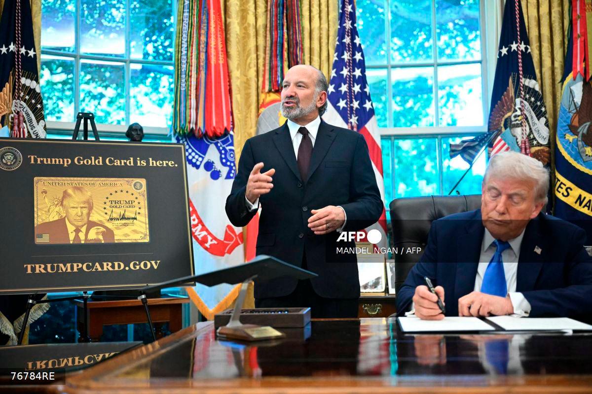 US Commerce Secretary Howard Lutnick (L) speaks as President Donald Trump looks on in the Oval Office of the White House in Washington, DC on September 19, 2025. - AFP