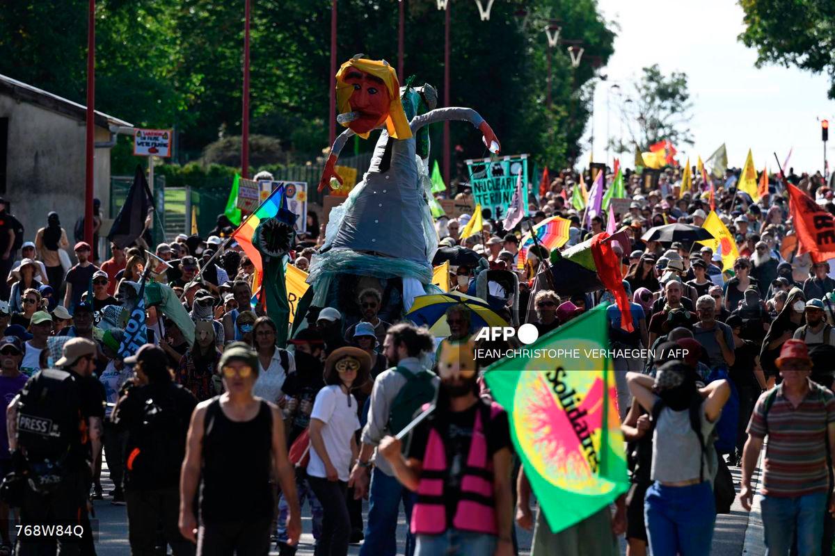 Anti-nuclear activists demonstrate during a march called La manif du futur (Protest of the future) near ANDRA laboratory and radioactive waste disposal site in Bure, northeastern France on September 20, 2025. - AFP