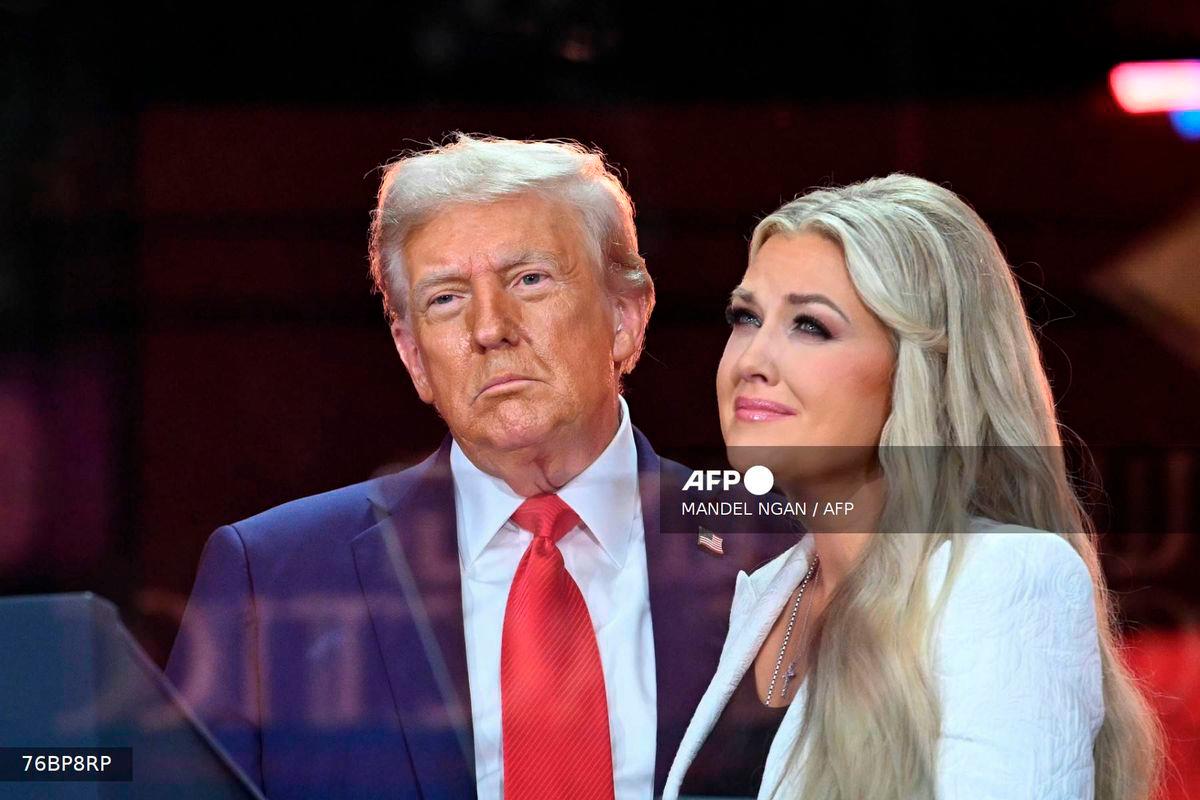 US President Donald Trump greets Erika Kirk, Charlie Kirk's widow during the public memorial service for right-wing activist Charlie Kirk at State Farm Stadium in Glendale, Arizona, on September 21, 2025. - AFP