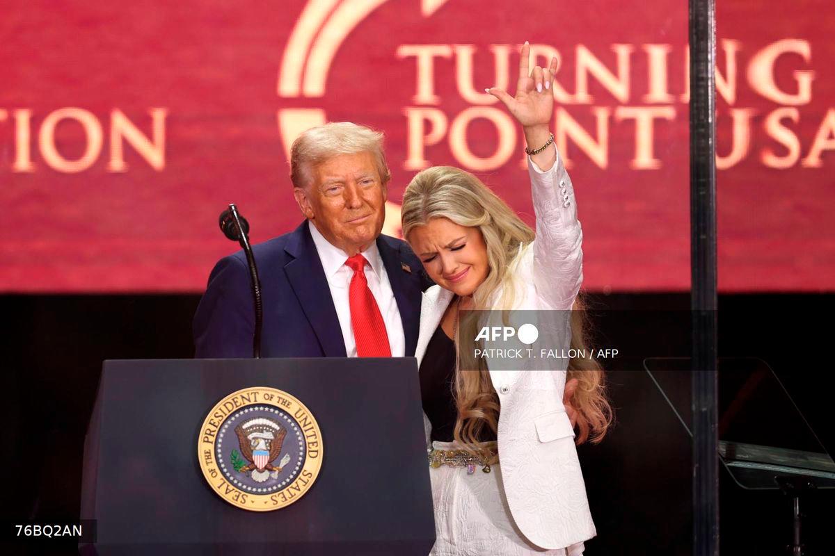 US President Donald Trump and Erika Kirk, Charlie Kirk's widow, gesture during the public memorial service for right-wing activist Charlie Kirk at State Farm Stadium in Glendale, Arizona, on September 21, 2025. - AFP