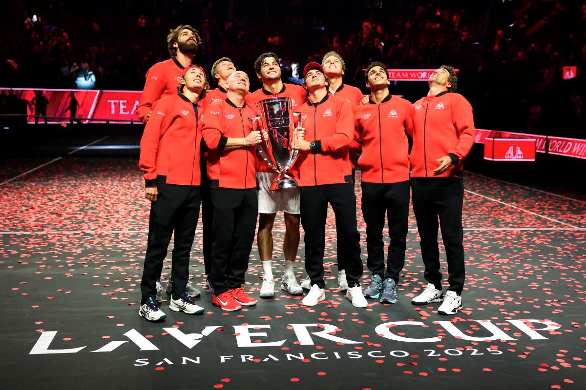 Reilly Opelka of Team World, Alex De Minaur of Team World, Team World Captain Andre Agassi, Jenson Brooksby of Team World, Taylor Fritz of Team World, Joao Fonseca of Team World, Alex Michelsen of Team World, Francisco Cerundolo of Team World, and Team World Vice Captain Patrick Rafter pose with the Laver Cup Trophy after defeating Team Europe during day three of Laver Cup 2025 at Chase Center on September 21, 2025 in San Francisco, California. - Getty Images via AFP