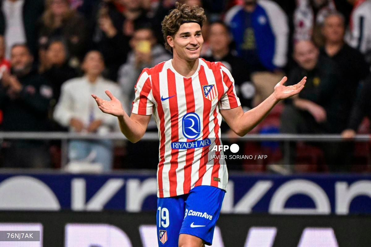 Atletico Madrid's Argentine forward #19 Julian Alvarez celebrates after scoring their third goal during the Spanish league football match between Club Atletico de Madrid and Rayo Vallecano de Madrid at the Metropolitano stadium in Madrid on September 24, 2025. - AFP