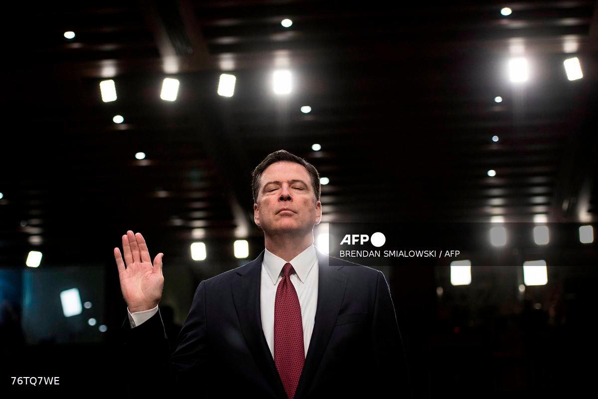 (FILES) Ousted FBI director James Comey is sworn in during a hearing before the Senate Select Committee on Intelligence on Capitol Hill June 8, 2017 in Washington, DC. -AFP