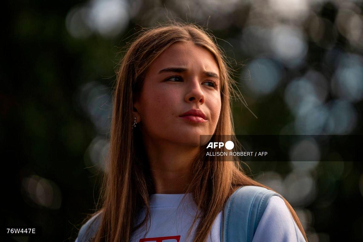 US President Donald Trump’s granddaughter Kai Trump looks on as Trump speaks to the press outside of the White House in Washington, DC, on September 26, 2025 ahead of a trip to the Ryder Cup in Bethpage, New York. (Photo by Allison ROBBERT / AFP)