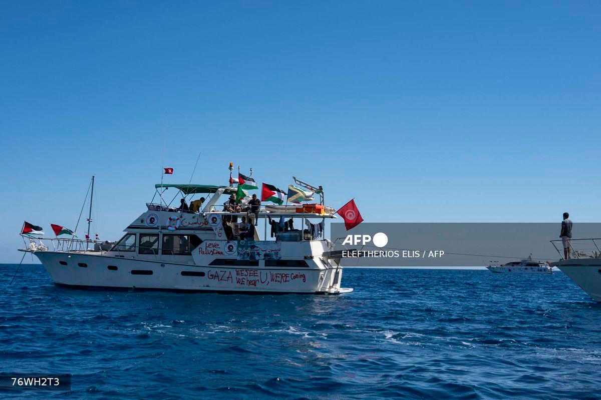 Members of the group of ships of the Global Sumud Flotilla to Gaza are seen moored at the small island of Koufonisi, south of the island of Crete, on September 26, 2025. - AFP