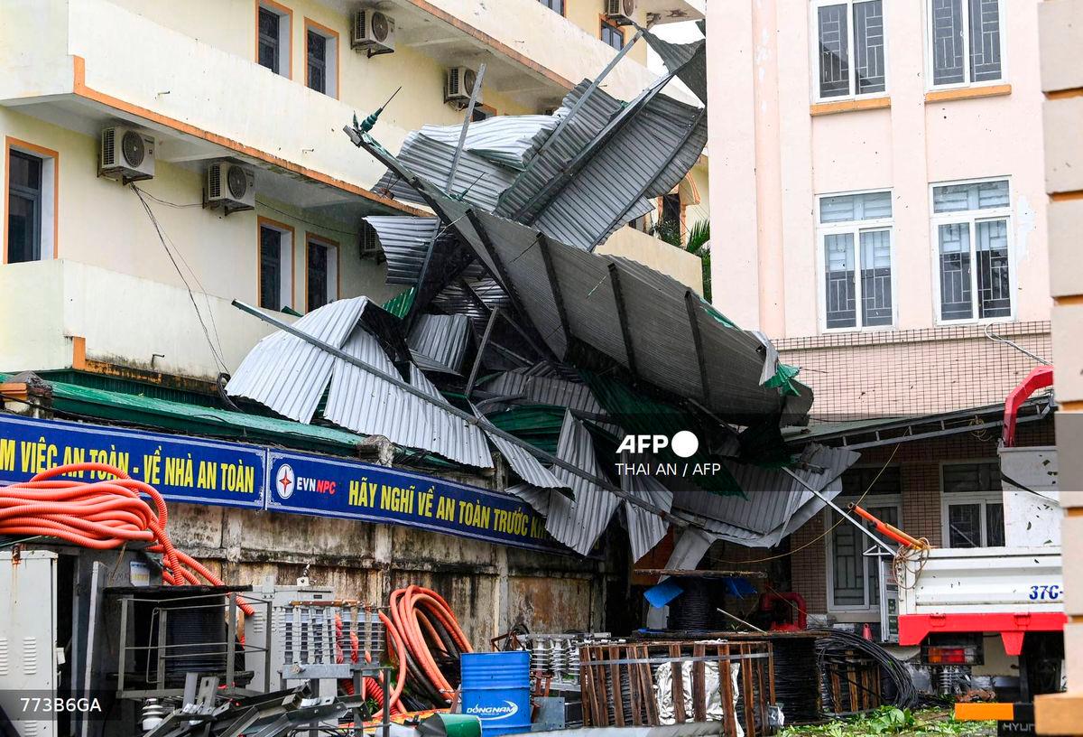 This picture shows a corrugated iron roof blown off after typhoon Bualoi made a landfall in Nghe An province on September 29, 2025. (Photo by Thai An / AFP)