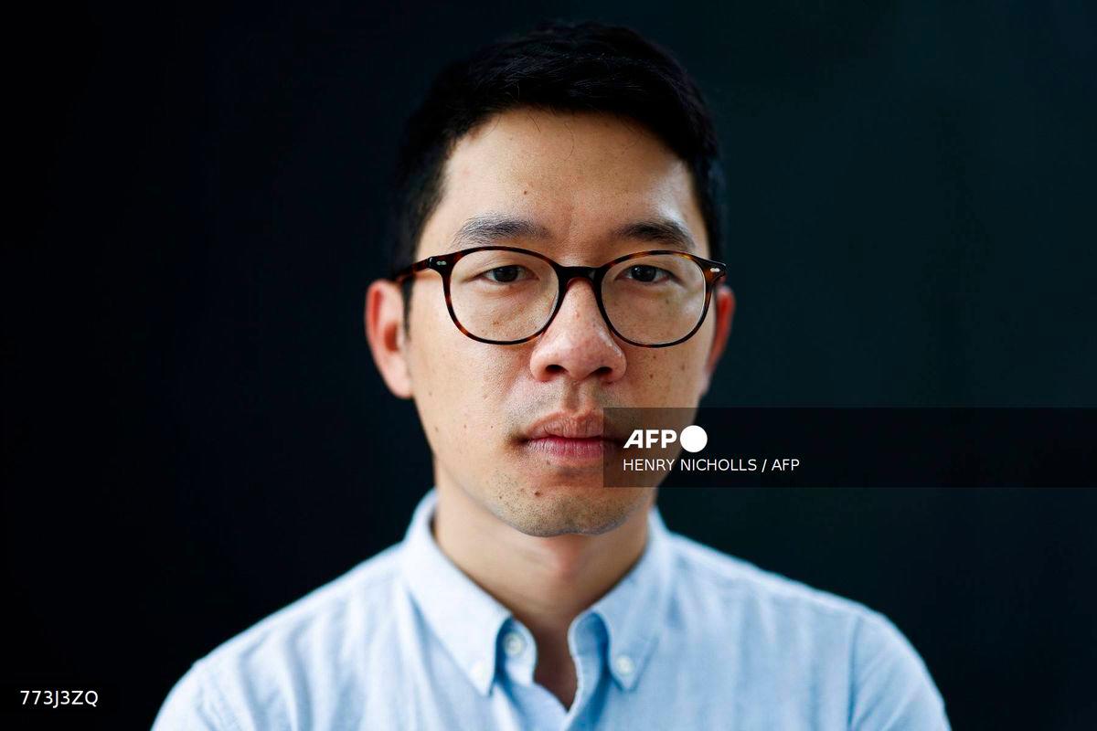 (FILES) In this picture taken on August 18, 2023, former Hong Kong legislator and pro-democracy activist Nathan Law poses for a photograph in London. (Photo by HENRY NICHOLLS / AFP)