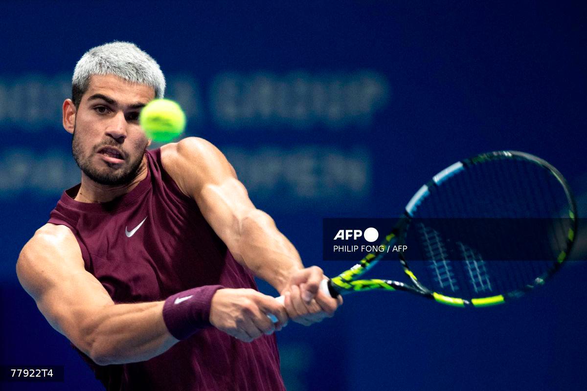 Spain's Carlos Alcaraz hits a return against USA's Taylor Fritz during their men’s singles final match at the ATP Japan Open tennis tournament in Tokyo on September 30, 2025. - AFP