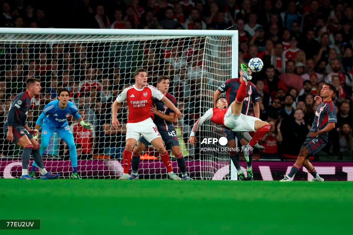 Arsenal's Brazilian midfielder #11 Gabriel Martinelli shoots but fails to score during the UEFA Champions League, league phase football match between Arsenal and Olympiacos at the Emirates Stadium in north London on October 1, 2025. - AFP