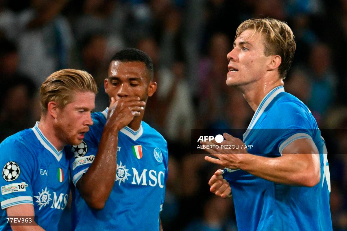 Napoli's Danish forward #19 Rasmus Hojlund celebrates scoring his team's first goal during the UEFA Champions League phase 2 football match Napoli vs Sporting Lisbon at the Diego Armando Maradona stadium in Naples on October 1, 2025. - AFP