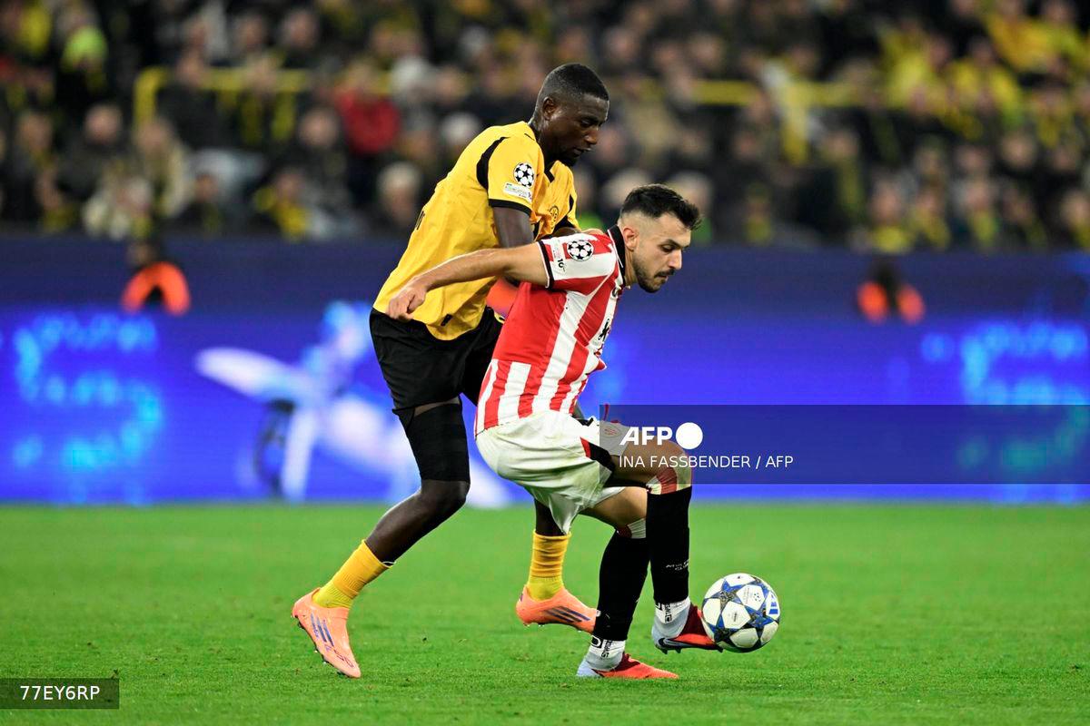 Dortmund's Guinean forward #09 Serhou Guirassy (L) and Athletic Bilbao's Spanish defender #04 Aitor Paredes vie for the ball during the UEFA Champions League - league phase day 2 football match of BVB Borussia Dortmund v Athletic Club Bilbao at the Signal Iduna stadium in Dortmund, western Germany on October 1, 2025. - AFP
