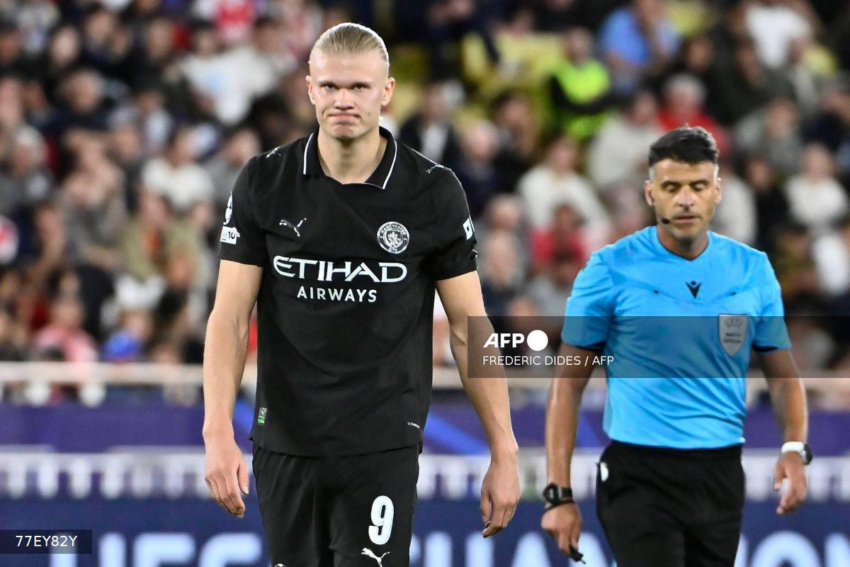 Manchester City's Norwegian striker #09 Erling Haaland (L) reacts during the UEFA Champions League, league phase day 2, football match between Monaco and Manchester City at Stade Louis II, in Monaco on October 1, 2025. - AFP