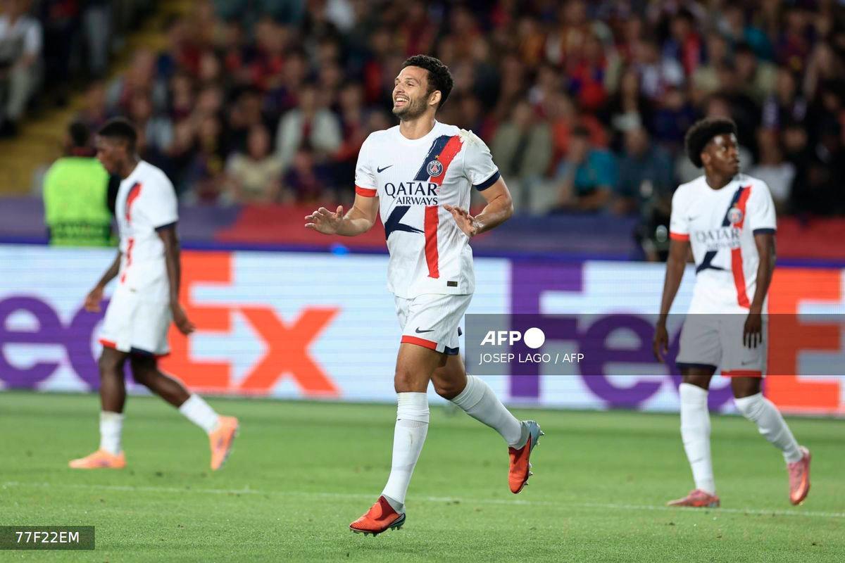 Paris Saint-Germain's Portuguese forward #09 Goncalo Ramos (C) celebrates scoring their second goal during the UEFA Champions League league phase day 2 football match between FC Barcelona and Paris Saint-Germain (PSG) at the Estadi Olimpic Lluis Companys in Barcelona, on October 1, 2025. - AFP