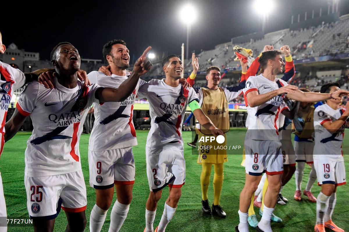 Paris Saint-Germain players celebrate winning the UEFA Champions League league phase day 2 football match between FC Barcelona and Paris Saint-Germain (PSG) at the Estadi Olimpic Lluis Companys in Barcelona, on October 1, 2025. - AFP