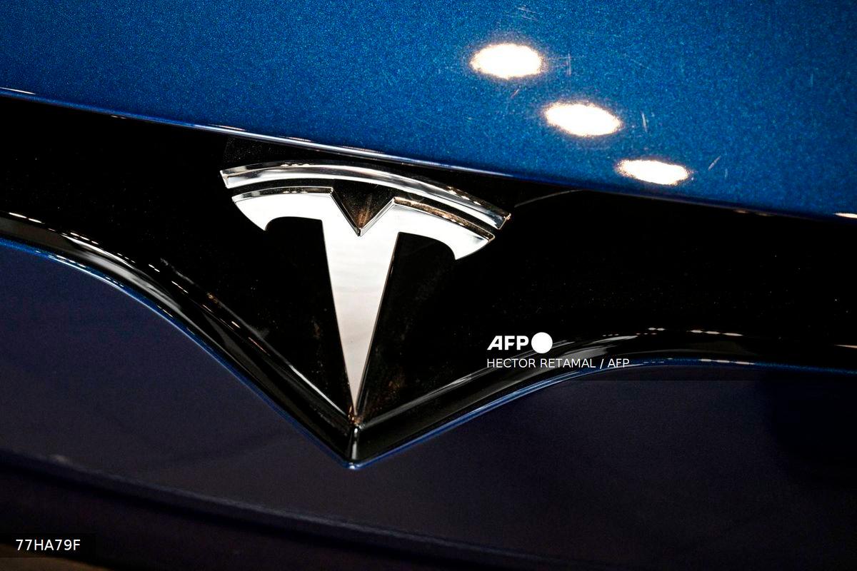 (FILES) A Tesla car is seen at a showroom for the US electric vehicle maker in the Jing'an district in Shanghai on April 9, 2025. - AFP