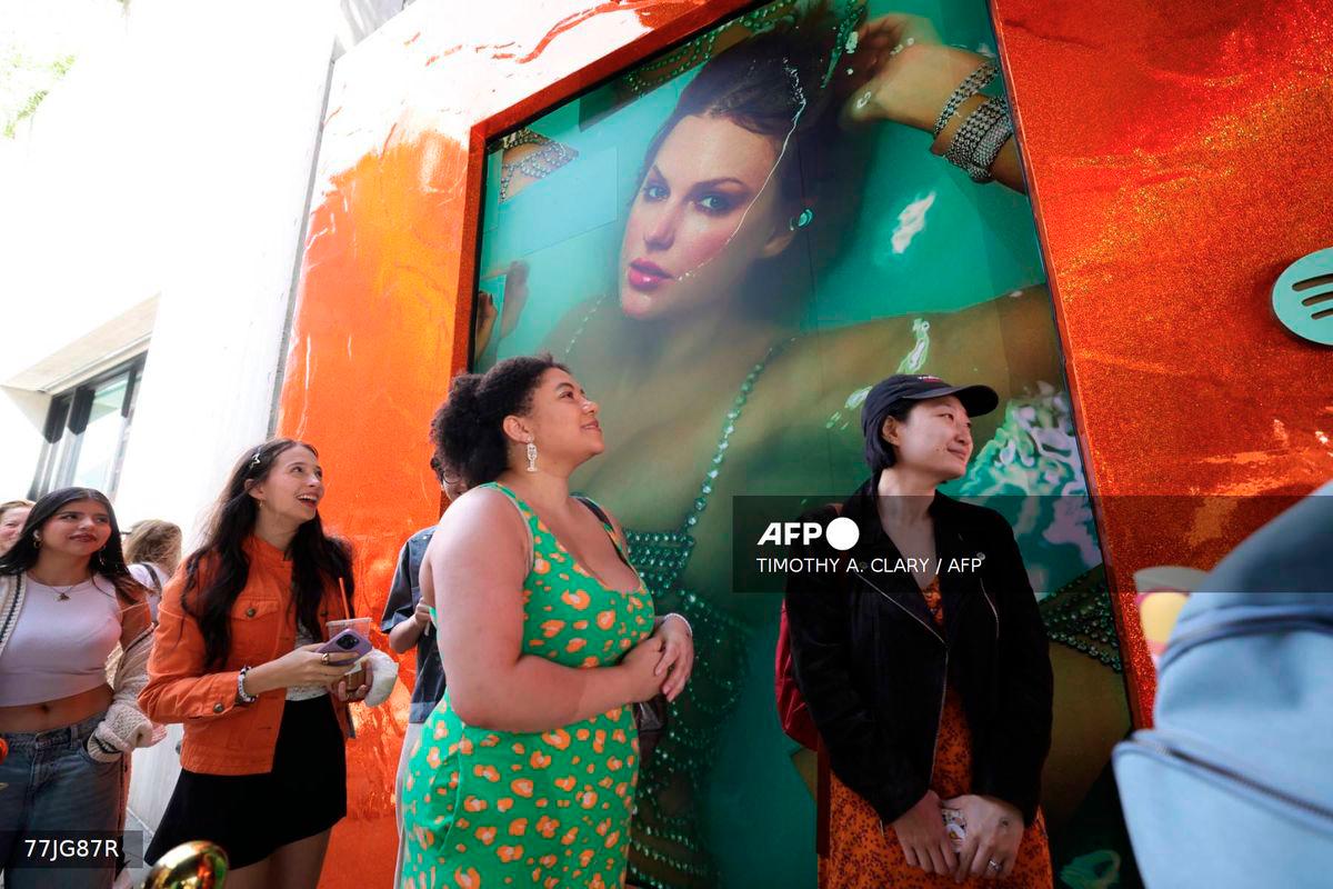Fans of US musician Taylor Swift, also known as Swifties, wait in line to attend The Life of a Showgirl pop-up event at Spotify's three-day immersive experience in New York on October 2, 2025, to celebrate Swift's upcoming album The Life of a Showgirl.. - AFP