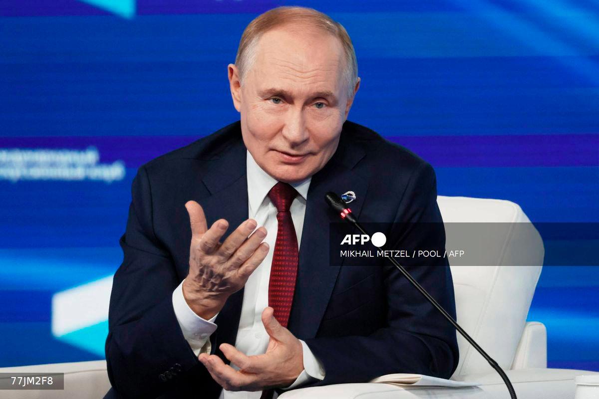 In this pool photograph distributed by the Russian state agency Sputnik, Russia's President Vladimir Putin attends the Valdai Discussion Club meeting in Sochi on October 2, 2025. - POOL / AFP