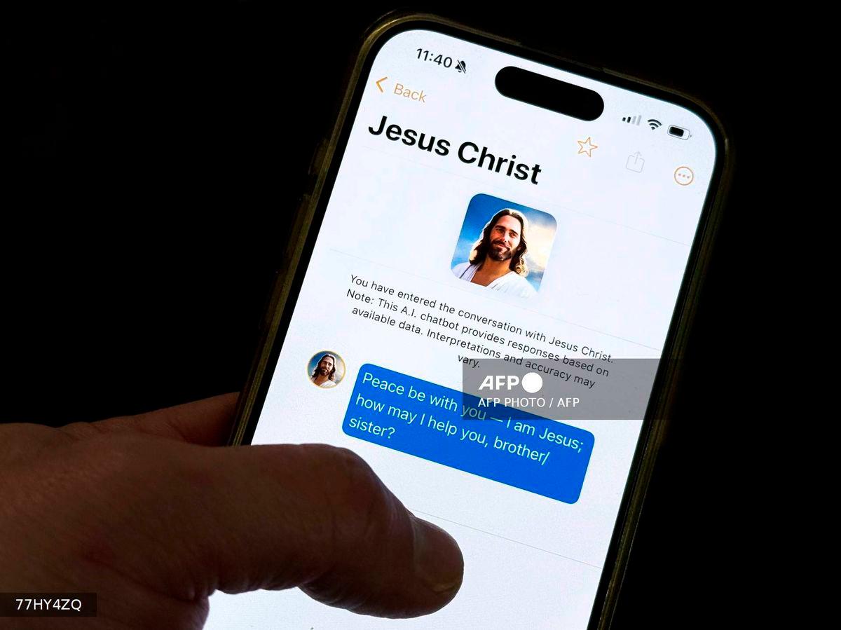 This photo illustration shows the Text With Jesus chatbot app displayed on an iPhone on October 2, 2025, in Washington, DC. - AFP