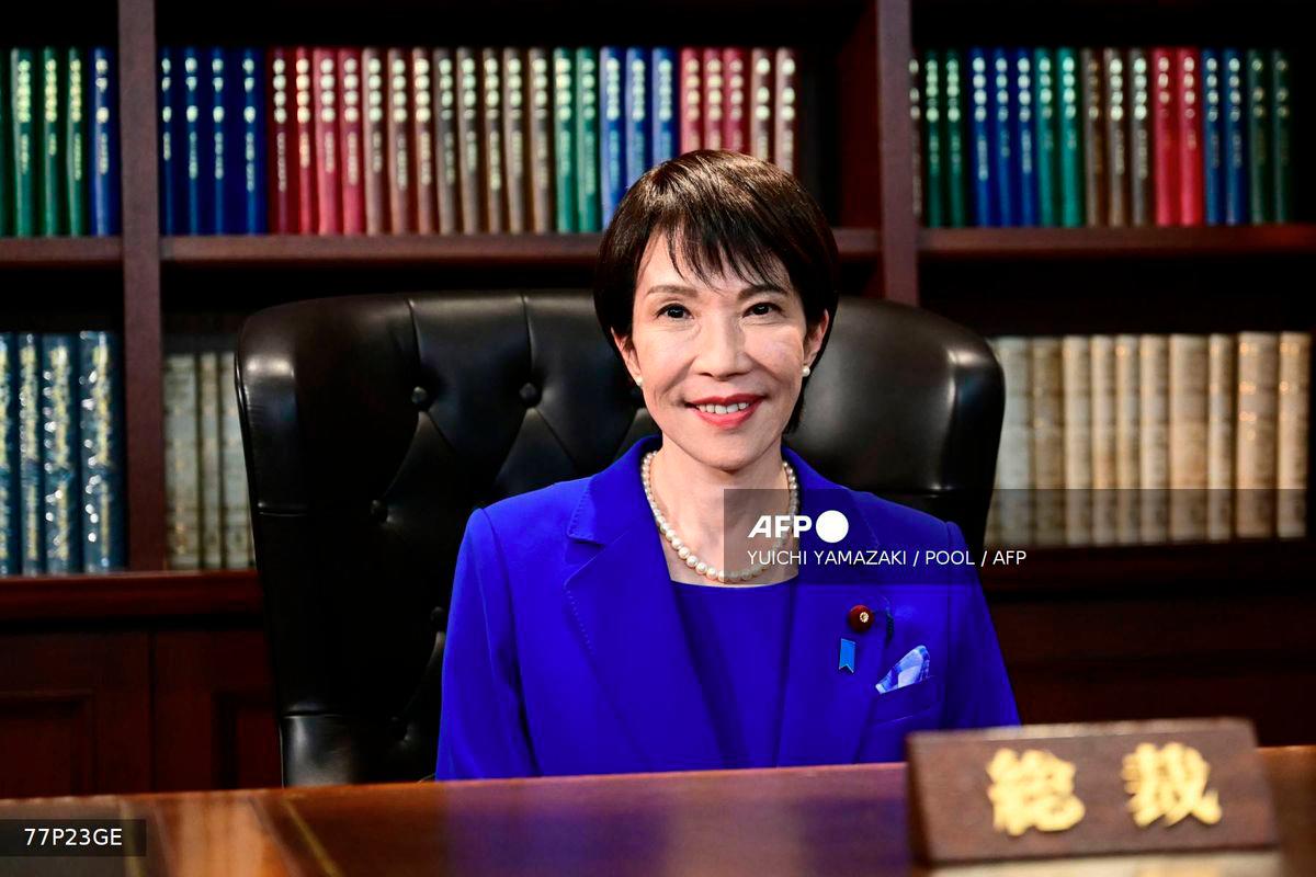 Sanae Takaichi, the newly elected leader of Japan's ruling party, the Liberal Democratic Party (LDP), poses in the party leader's office after the LDP leadership election in Tokyo on October 4, 2025. - POOL via AFP