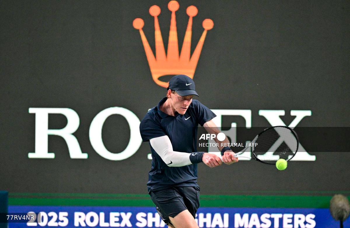 Italy's Jannik Sinner plays a backhand return to Netherlands' Tallon Griekspoor during their men's singles match at the Shanghai Masters tennis tournament in Shanghai on October 5, 2025. - AFP