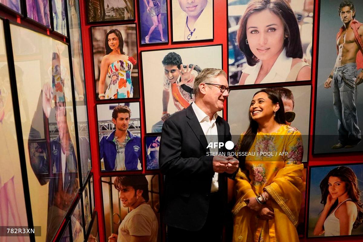 Britain’s Prime Minister Keir Starmer interacts with Indian actress Rani Mukerji during a visit to Yash Raj Films, a Bollywood studio, in Mumbai on October 8, 2025. (Photo by Stefan Rousseau / POOL / AFP)